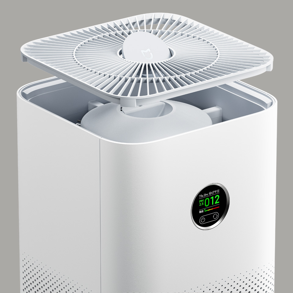 Nærbillede af toppen på Xiaomi Mijia Smart Air Purifier 6 med aftageligt gitter og det runde OLED-display, der viser luftkvaliteten.